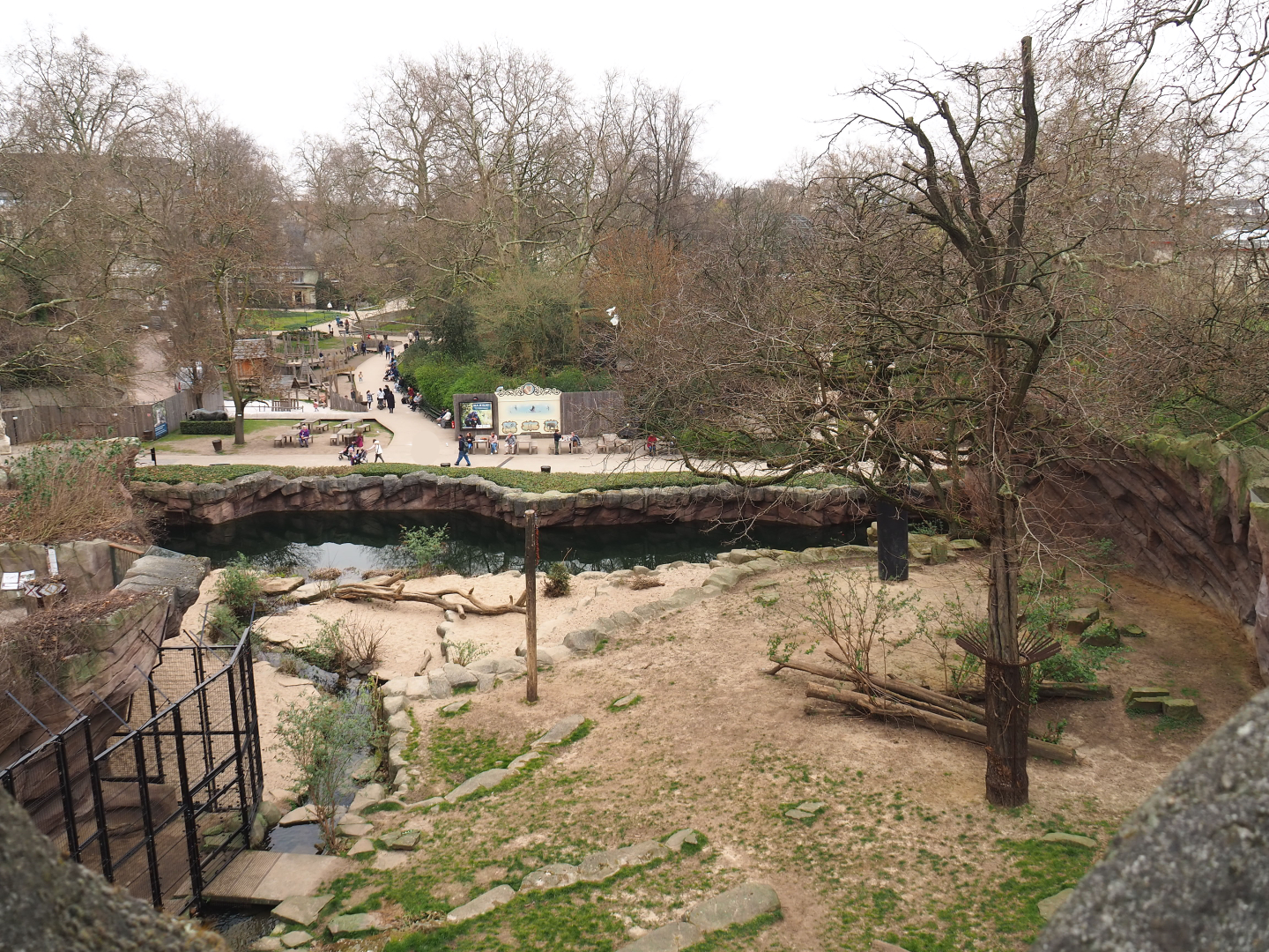 African lion exhibit seen from the panorama bridge, 2022-03-16