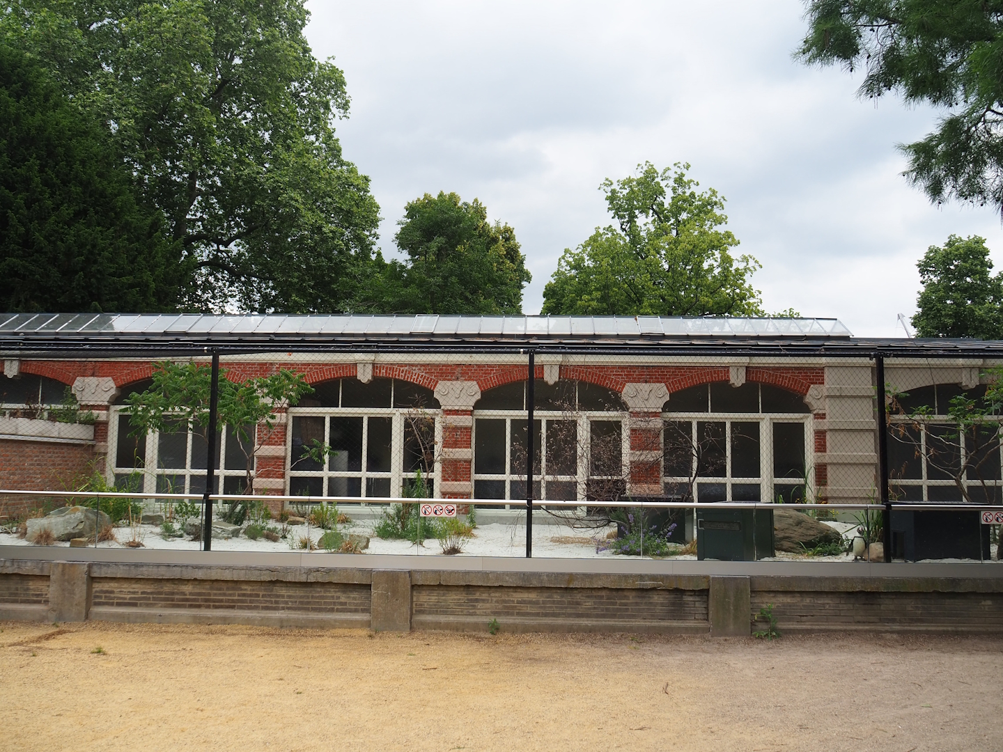 African penguin beach area next to historical Rotunda bird building, 2023-07-02