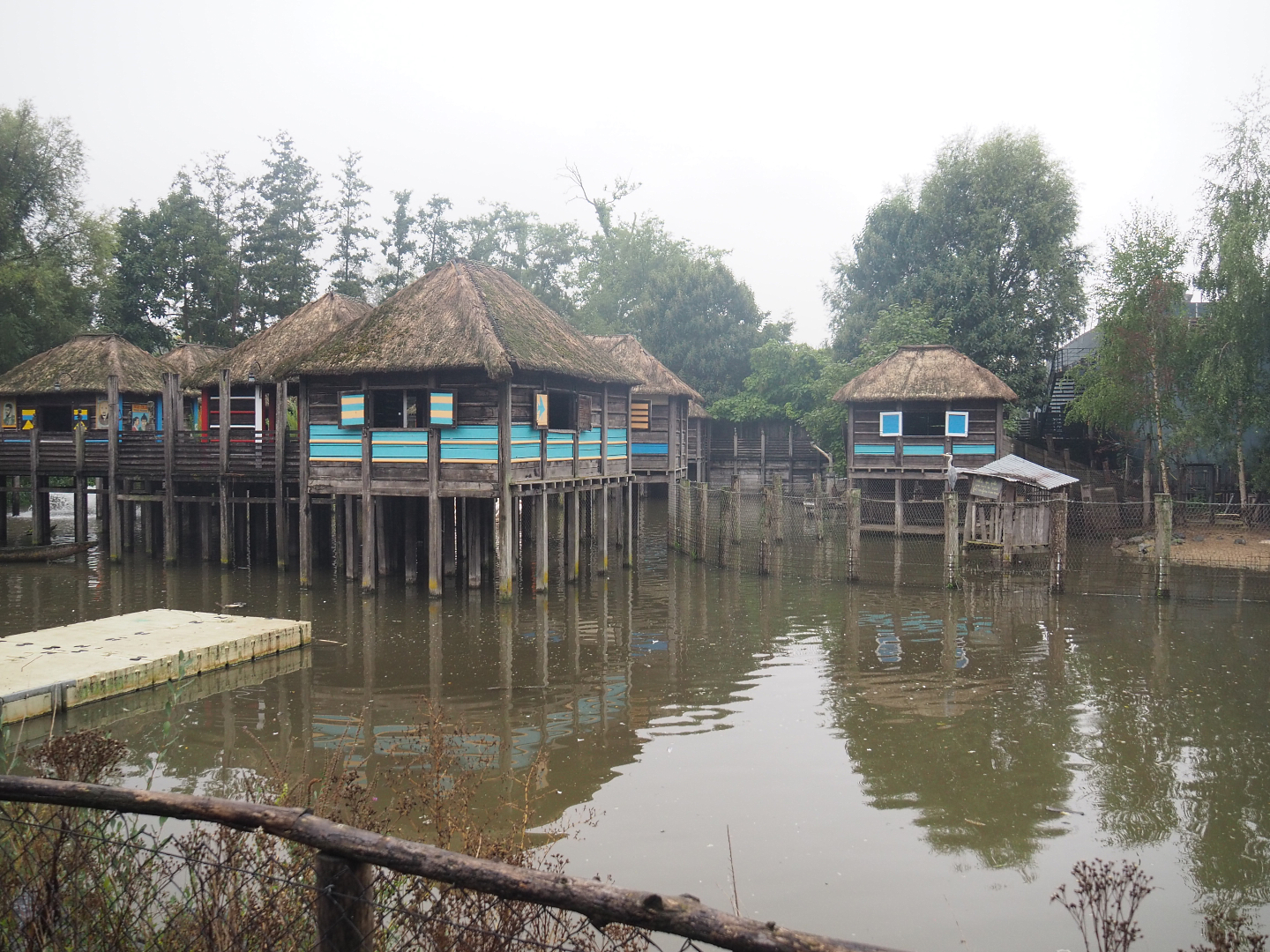 African stilt village inspired by Ganvié in Benin, seen from the train, 2022-09-14