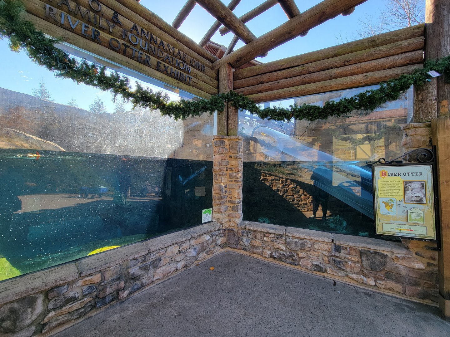 Akron Zoo - North American river otter exhibit, with clear slide for humans through the otters' water area