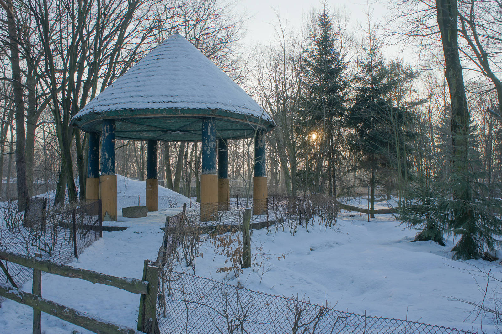 Antique gazebo in the middle of a open water fowl premise.