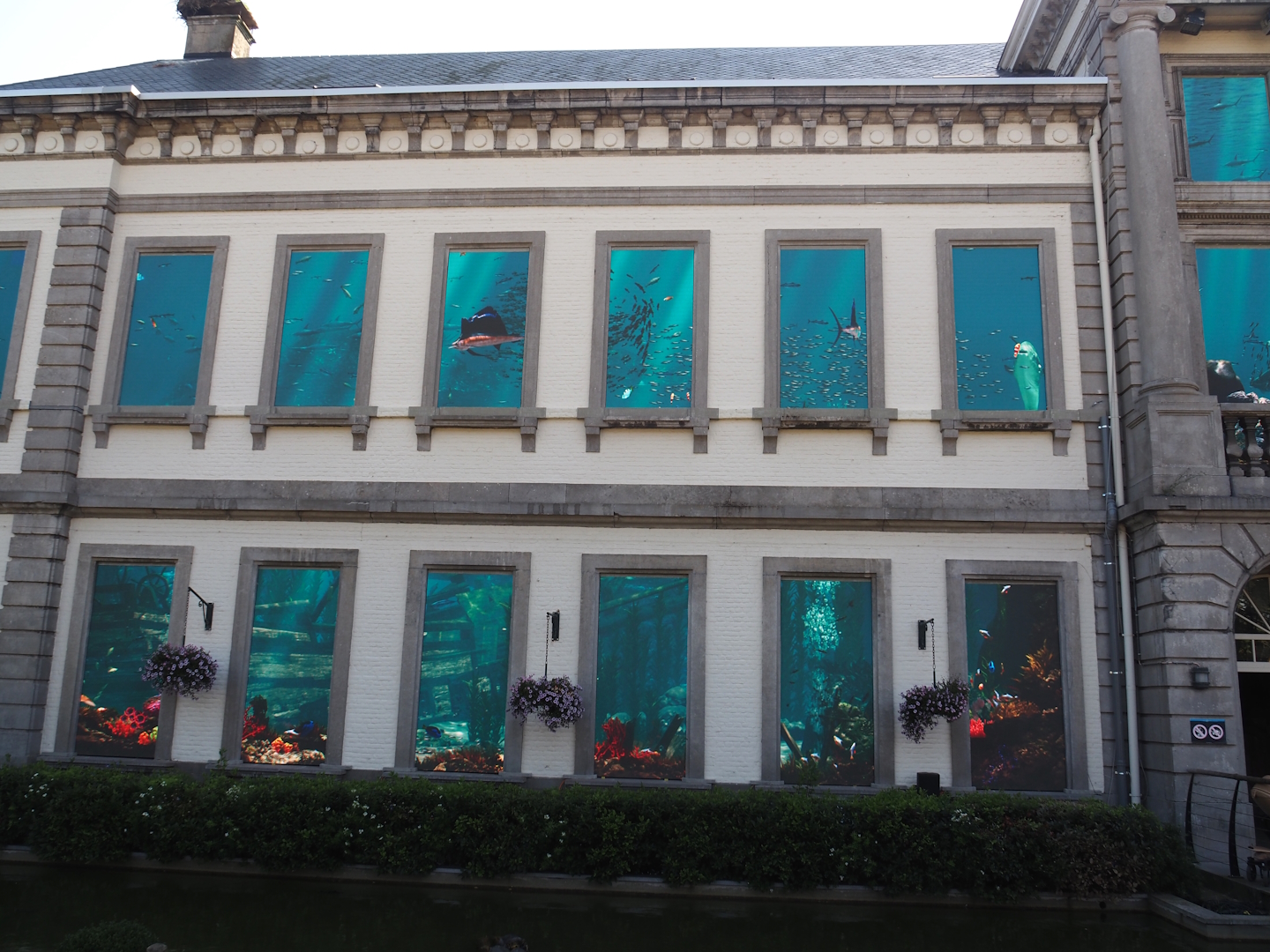 Aquarium building (1852 castle) with new ocean projection screens in windows, 2024-09-17