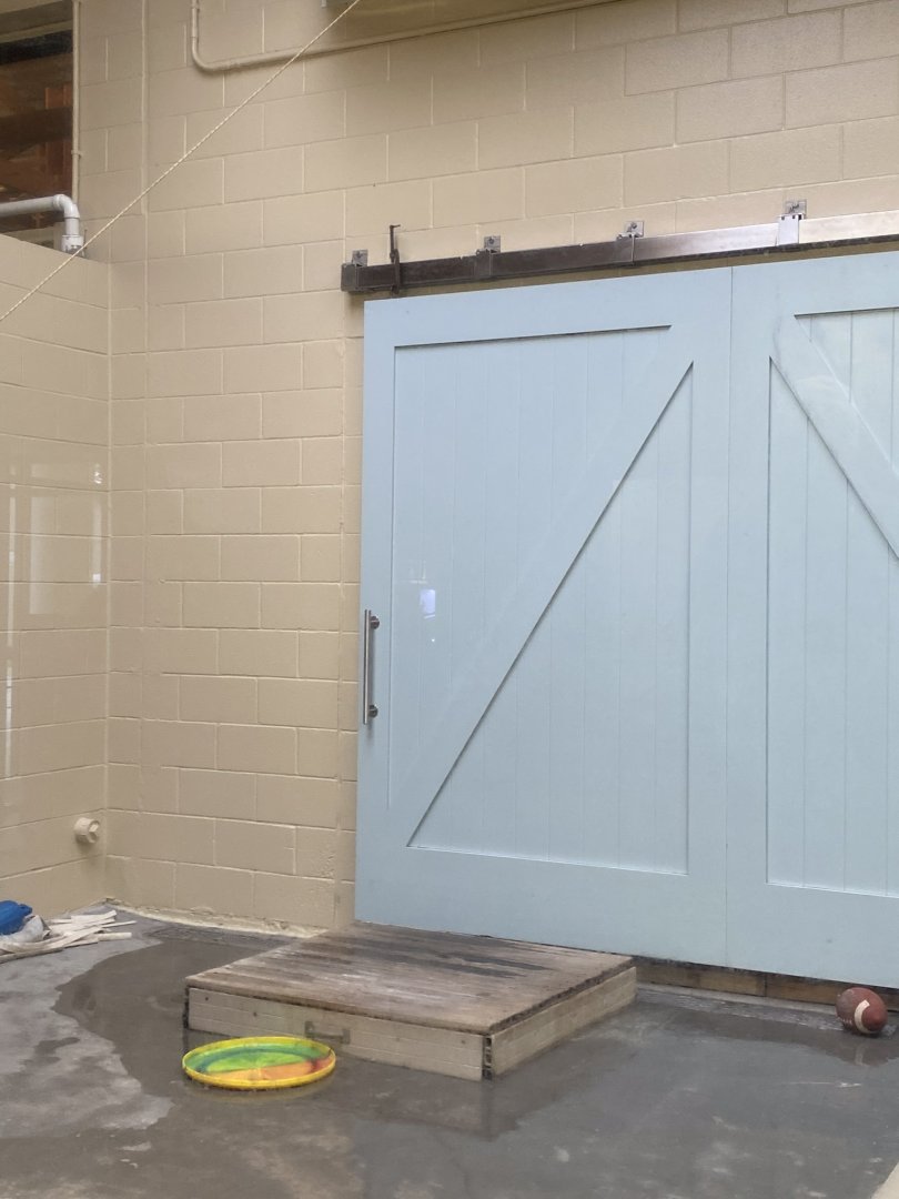 Aquatics building- new shifting door in renovated harbor seal “quarantine pool”