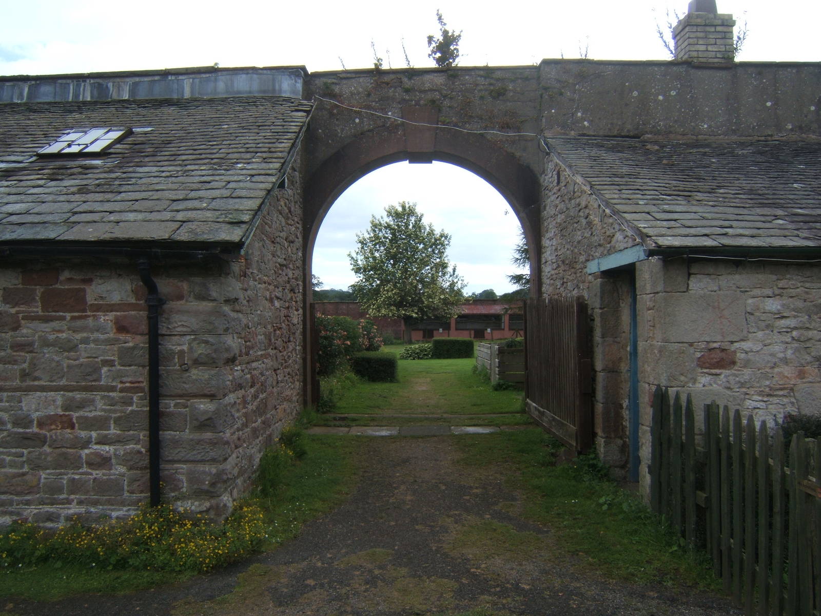 Arch way into walled garden