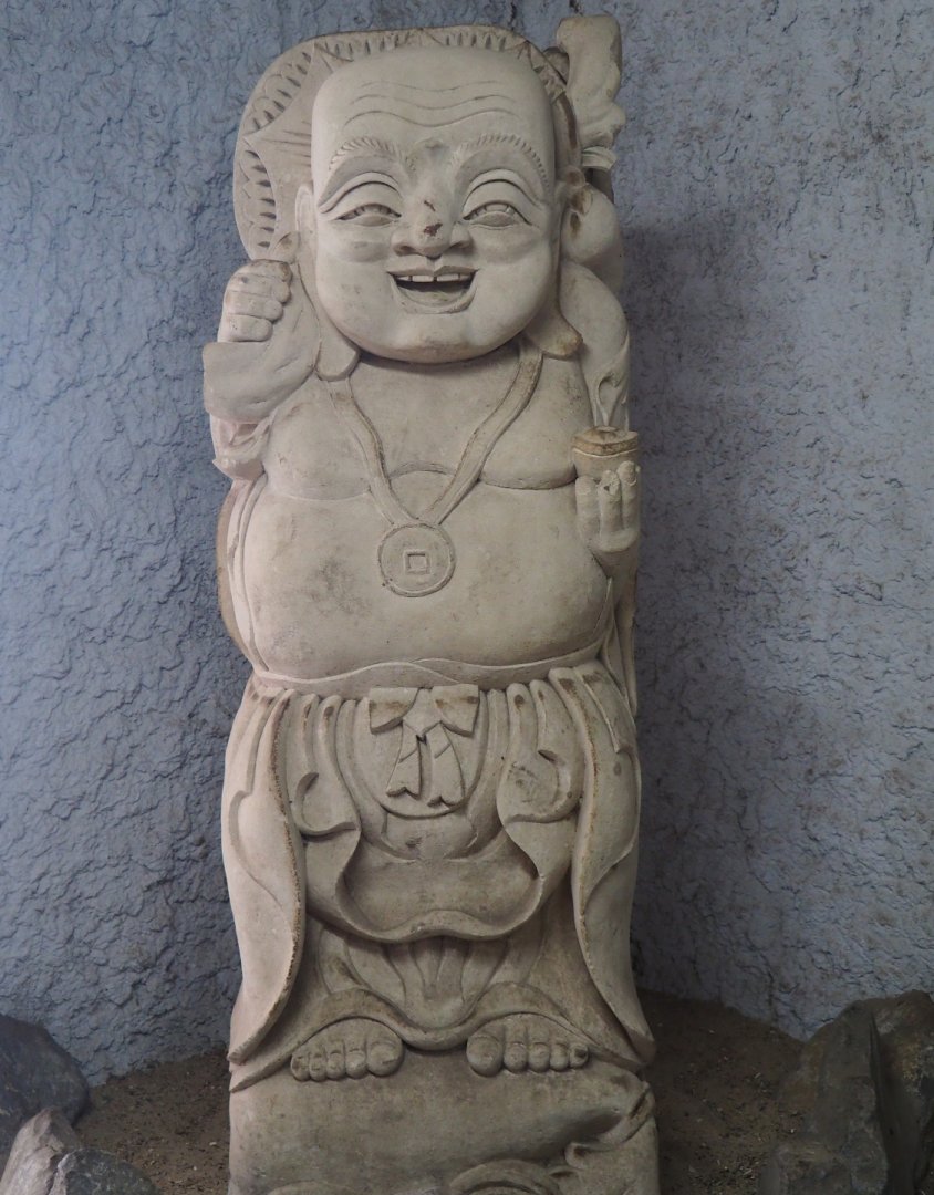Assorted objects in the entrance corridor to the tropical house - Buddha statue, 2019-08-04