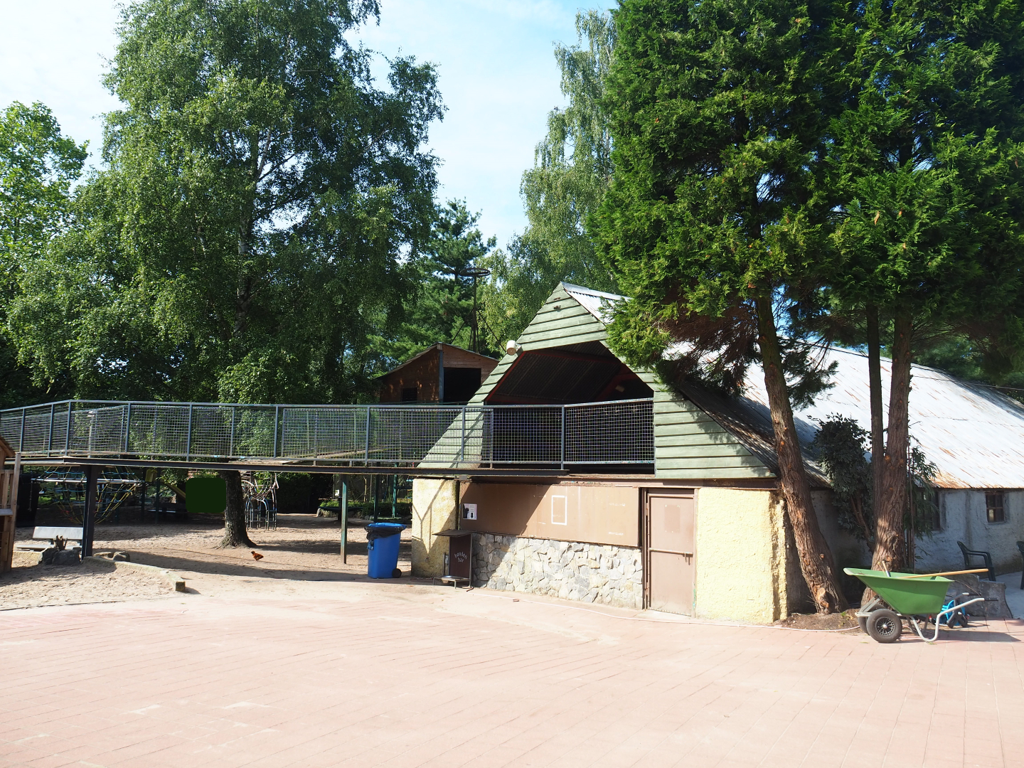 Backside of petting zoo barn with bridge for pygmy goats towards barns, 2019-06-01