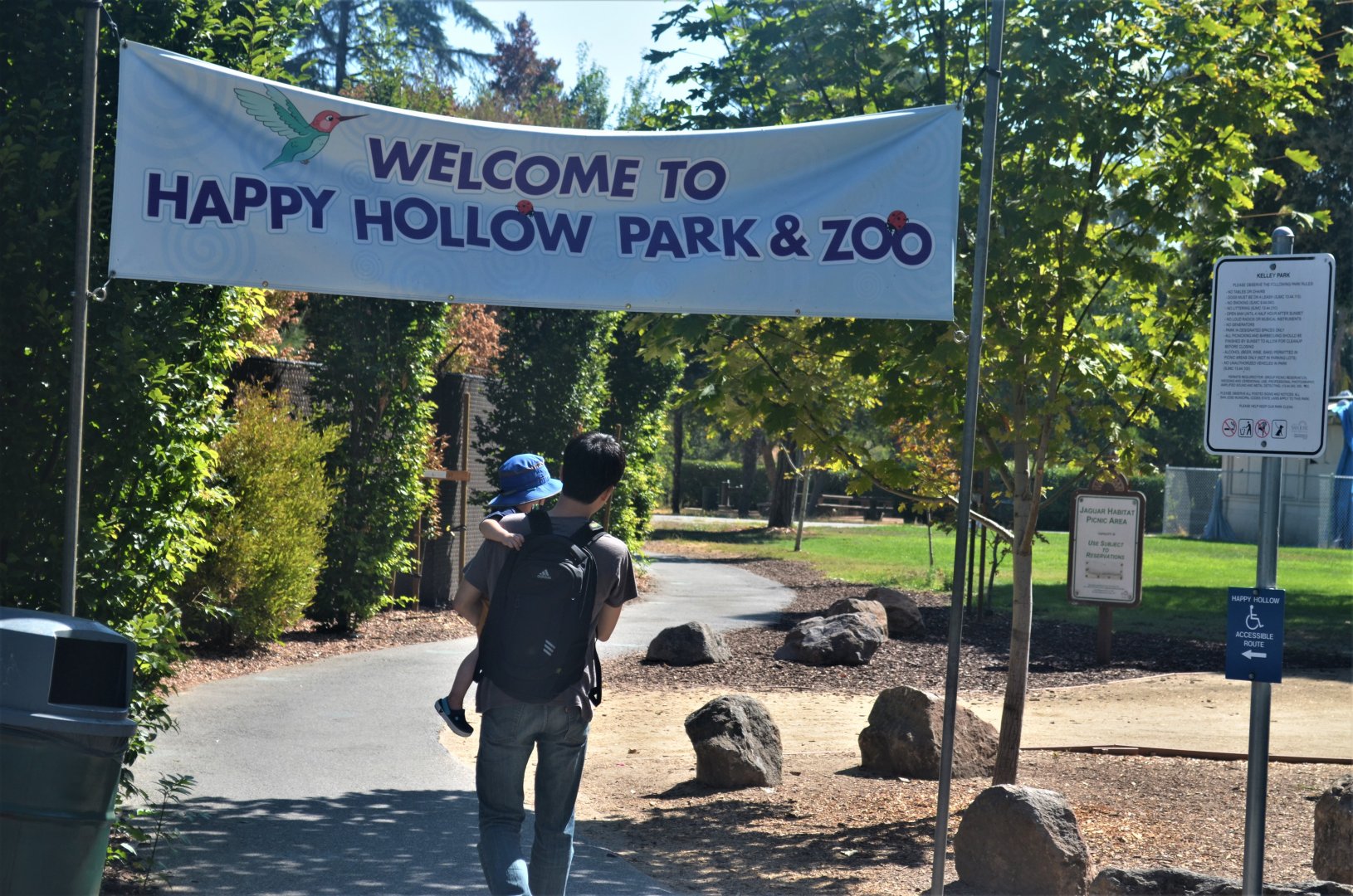 Banner and Pathway Leading From Parking Lot To Zoo