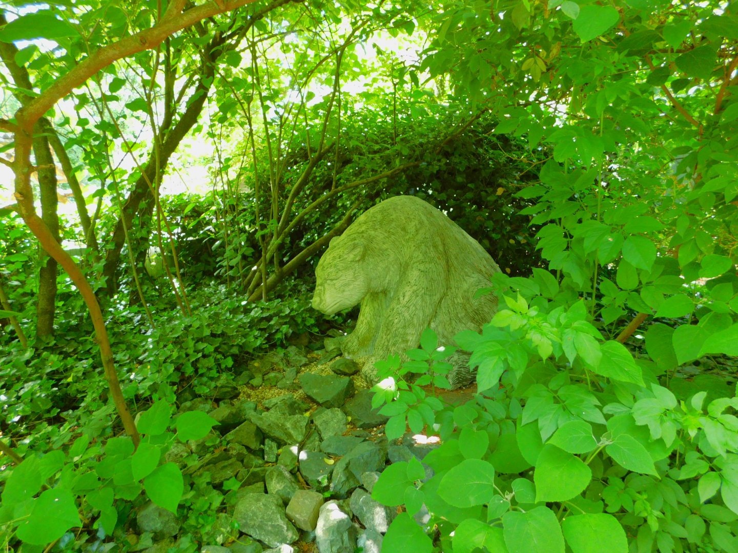 bear (statue) in grove