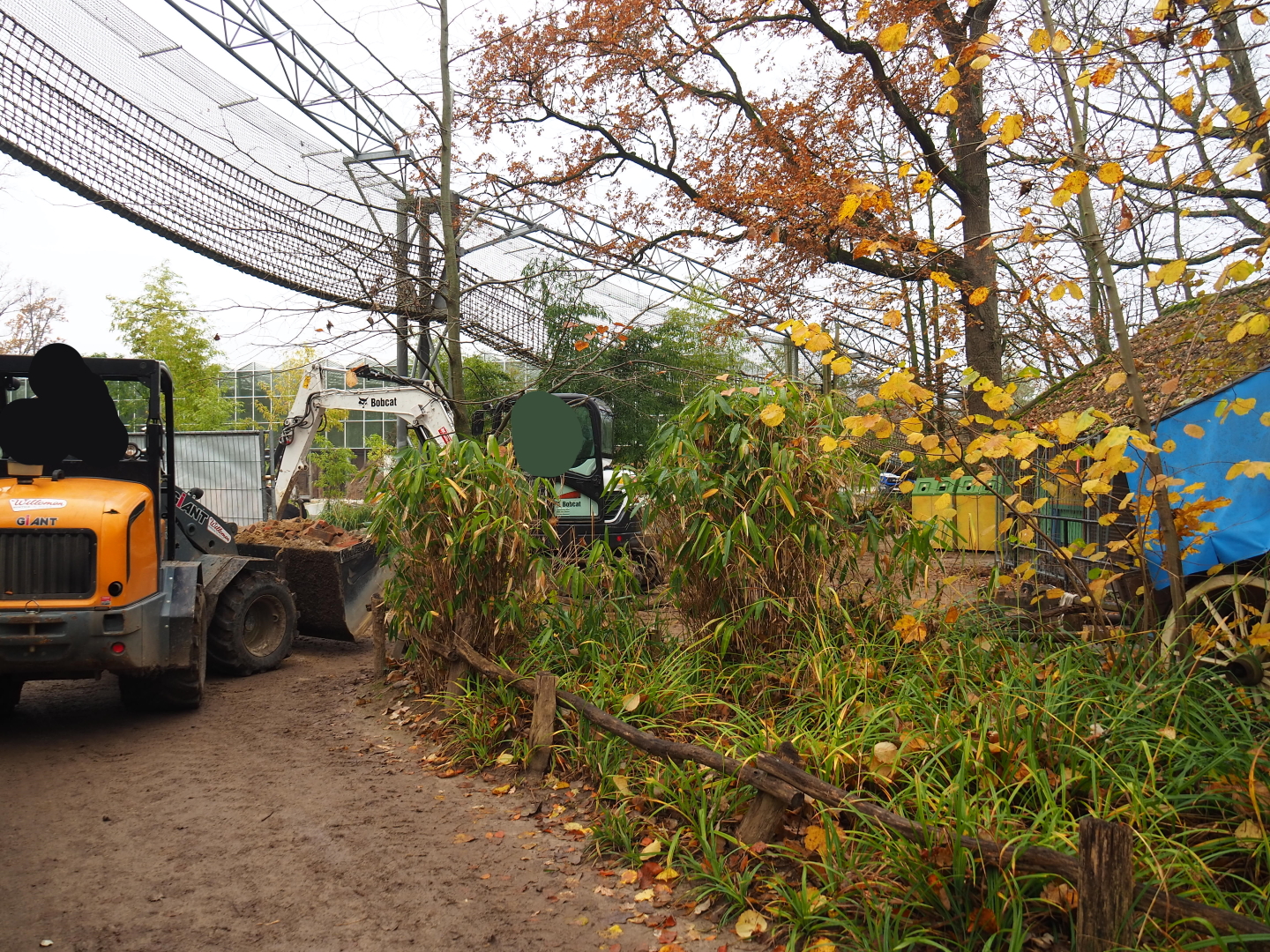 Brick square being broken up next to Orangutan project construction site, 2021-11-23