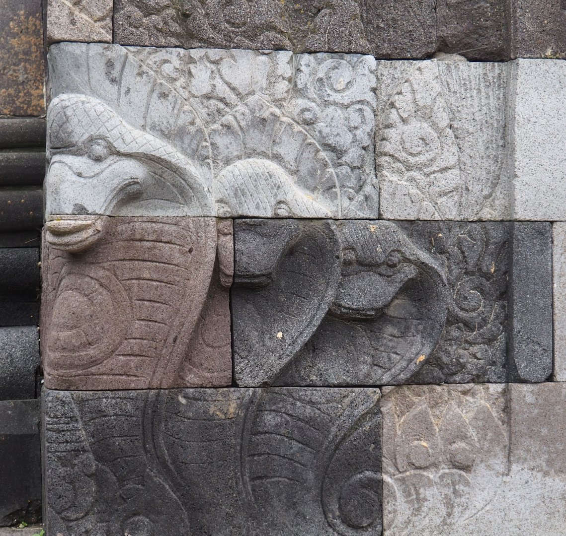 Cobra stone carvings on one of the Asian temples, 2023-05-15