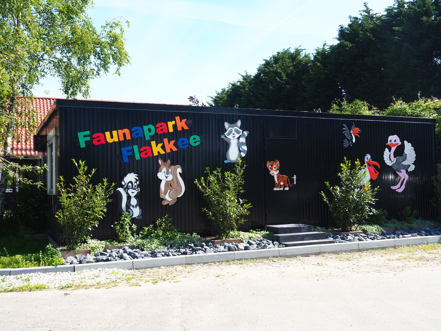Container building with animal cartoon figures next to the parking lot, 2019-06-01