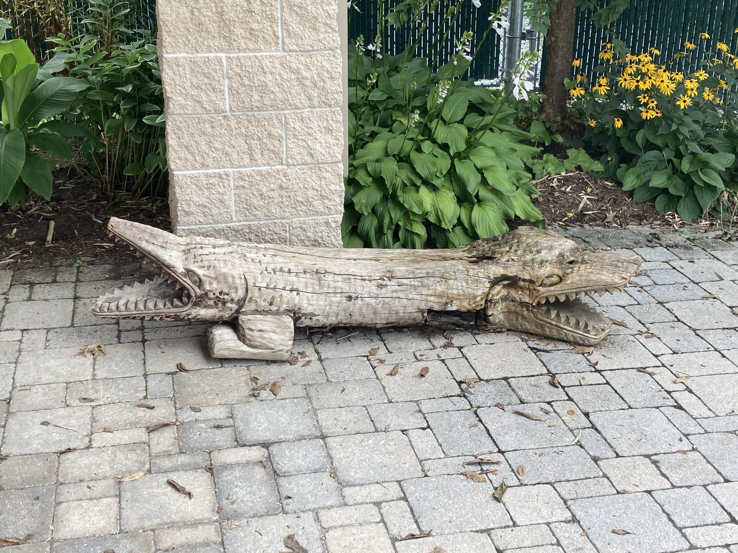 Double sided crocodilian statue art