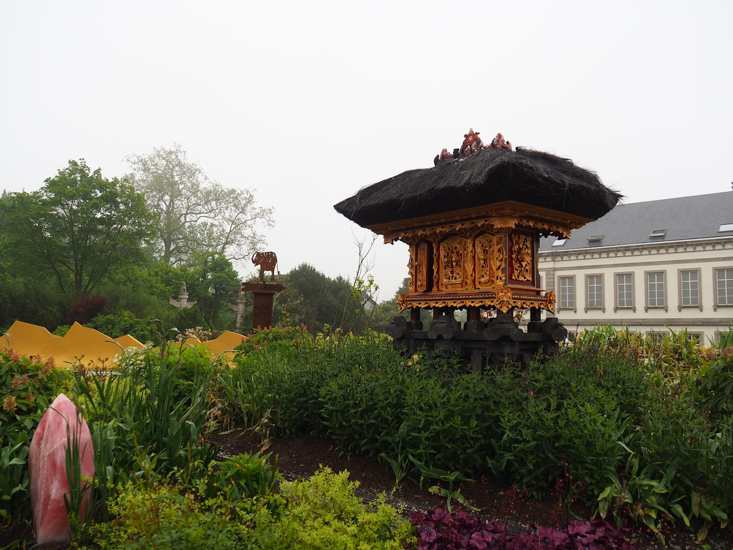 "Egg of the World" entrance area - Small representation of Balinese temples, With 1854 castle aquarium building behind it, 2023-05-16