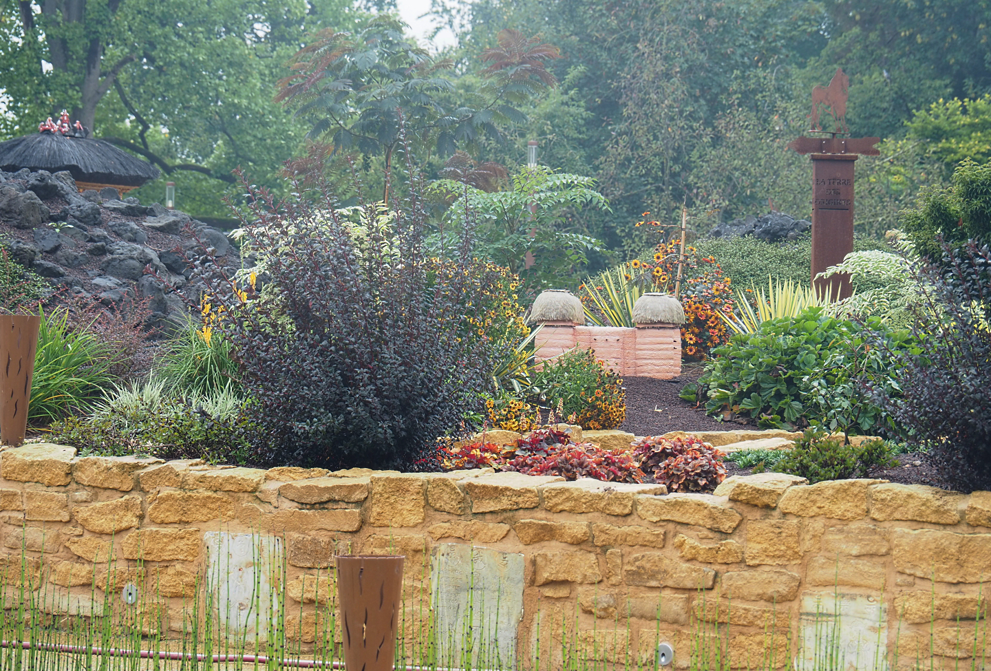 "Egg of the World" future entrance area - Road sign for and small representation of The Land of Origins, 2022-09-14