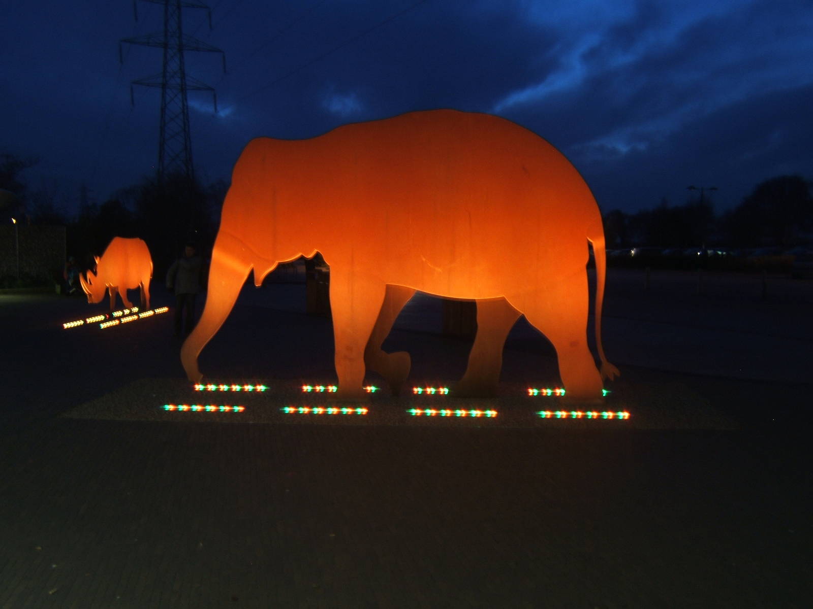 Elephant and Rhinoceros sculptures in the dark