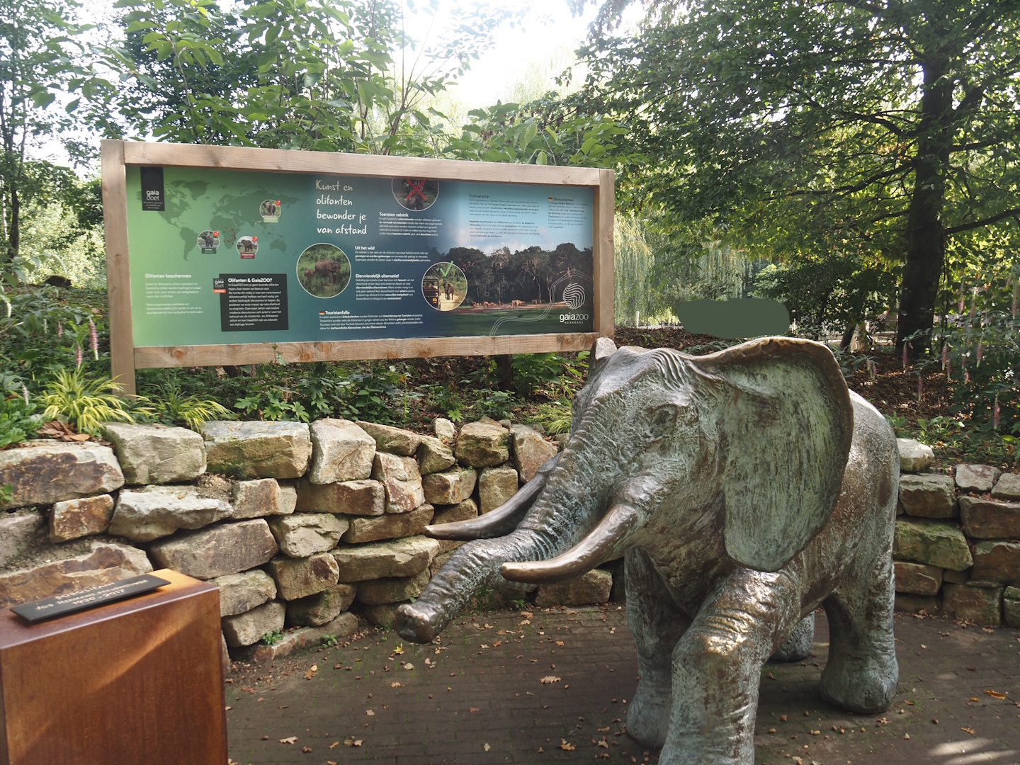 Elephant statue and responsible elephant tourism signage, 2025-09-30