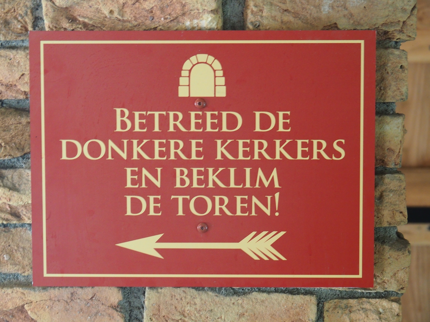 Enter the dungeons and climb the tower sign