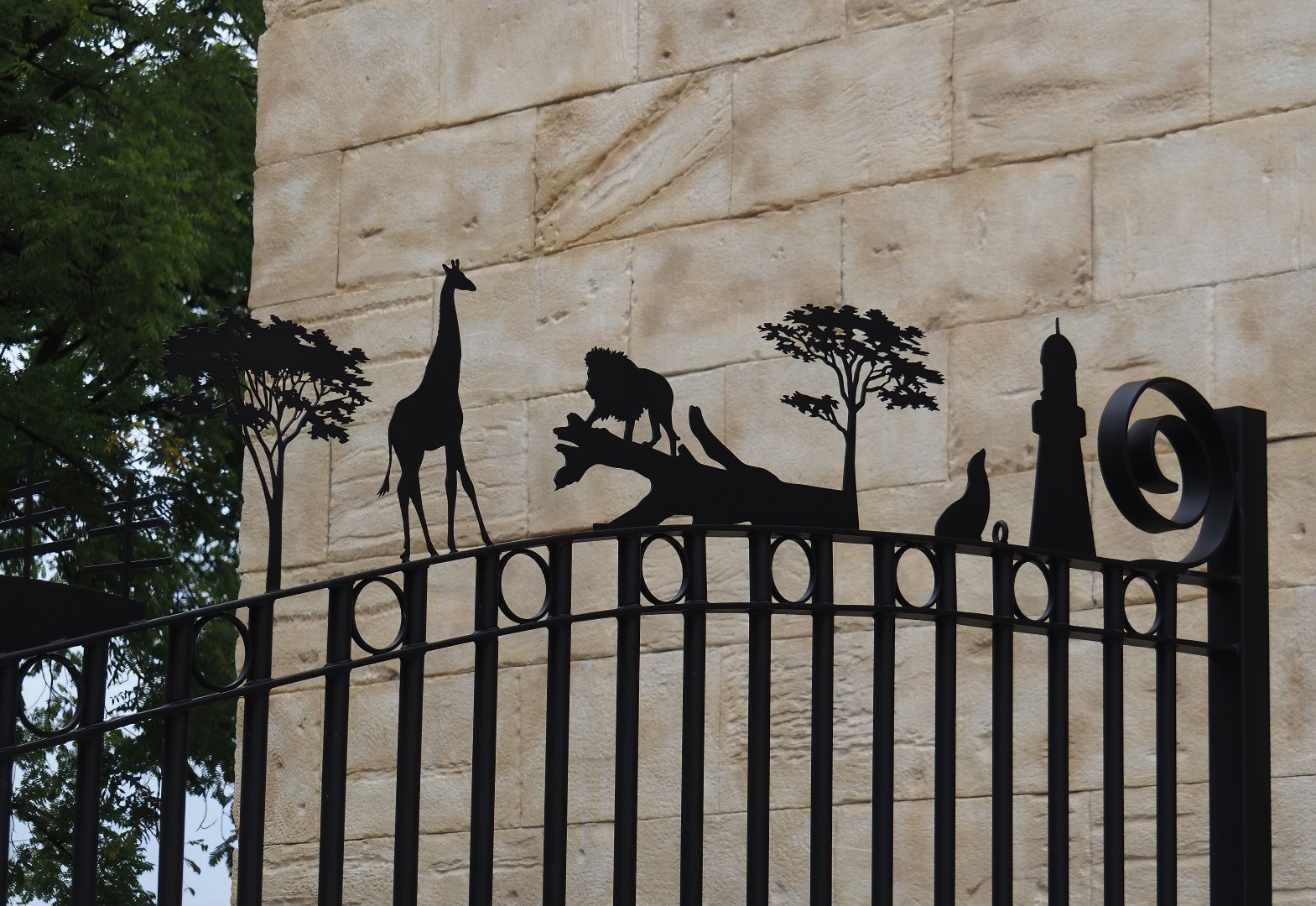 Entrance gate with metal cut-outs representing Pairi Daiza's worlds, 2024-09-17