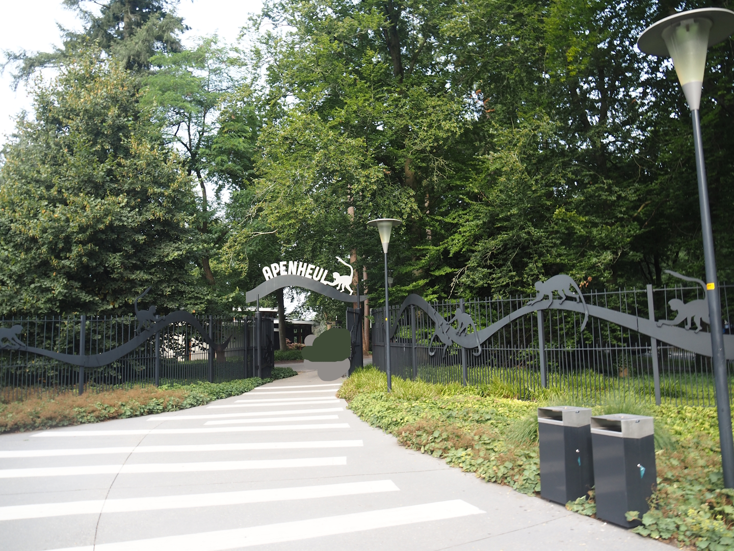 Entrance of route to Apenheul with Apenheul sign and monkey cut-outs, 2024-08-18