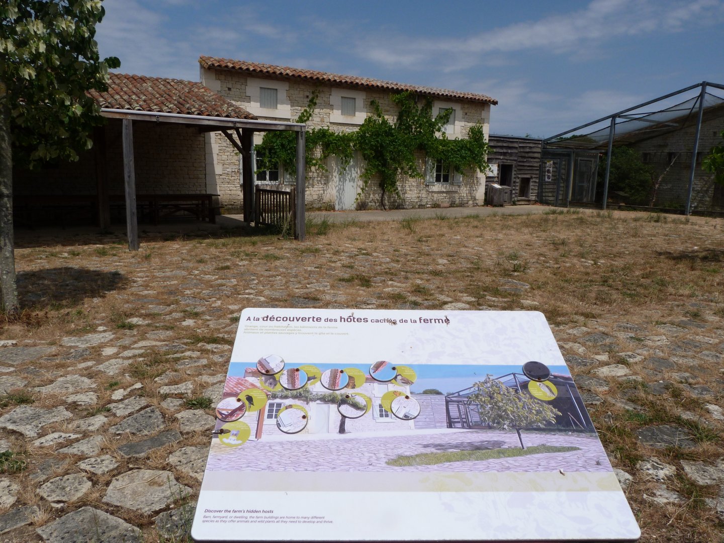 Farmhouse and a sign about it's inhabitants -Zoodyssée (2025)
