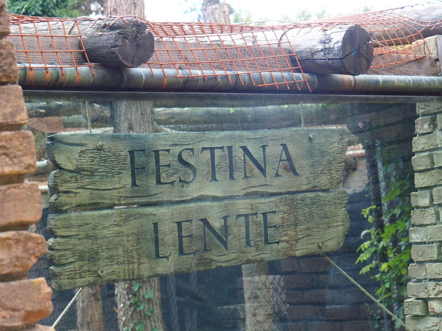 Festina lente - Make haste slowly signs