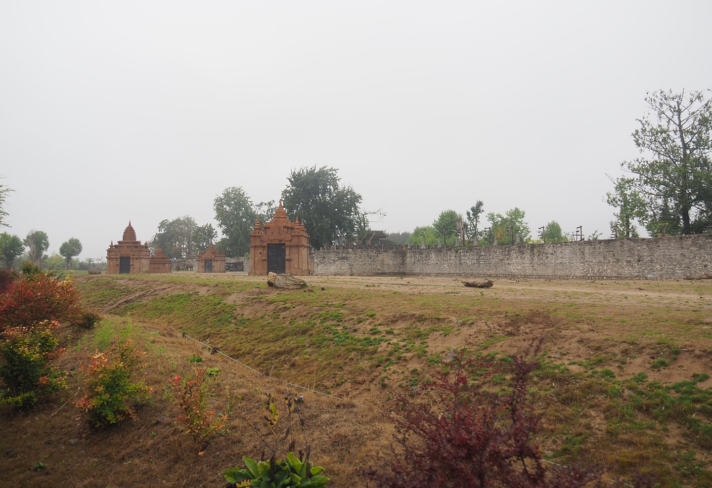 First large Asian elephant paddock seen from the train, 2022-09-14