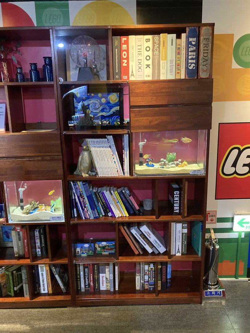 Fish in a bookshelf plus obligatory lego