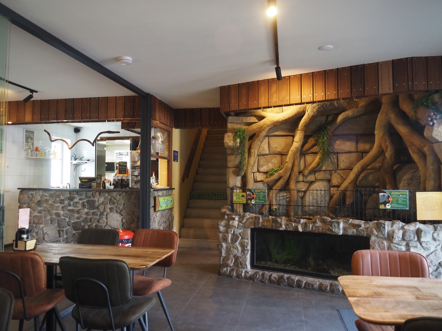 Food and drinks counter, stairs to animal attic and Silver arowana and Tiger oscar tank, 2025-04-12