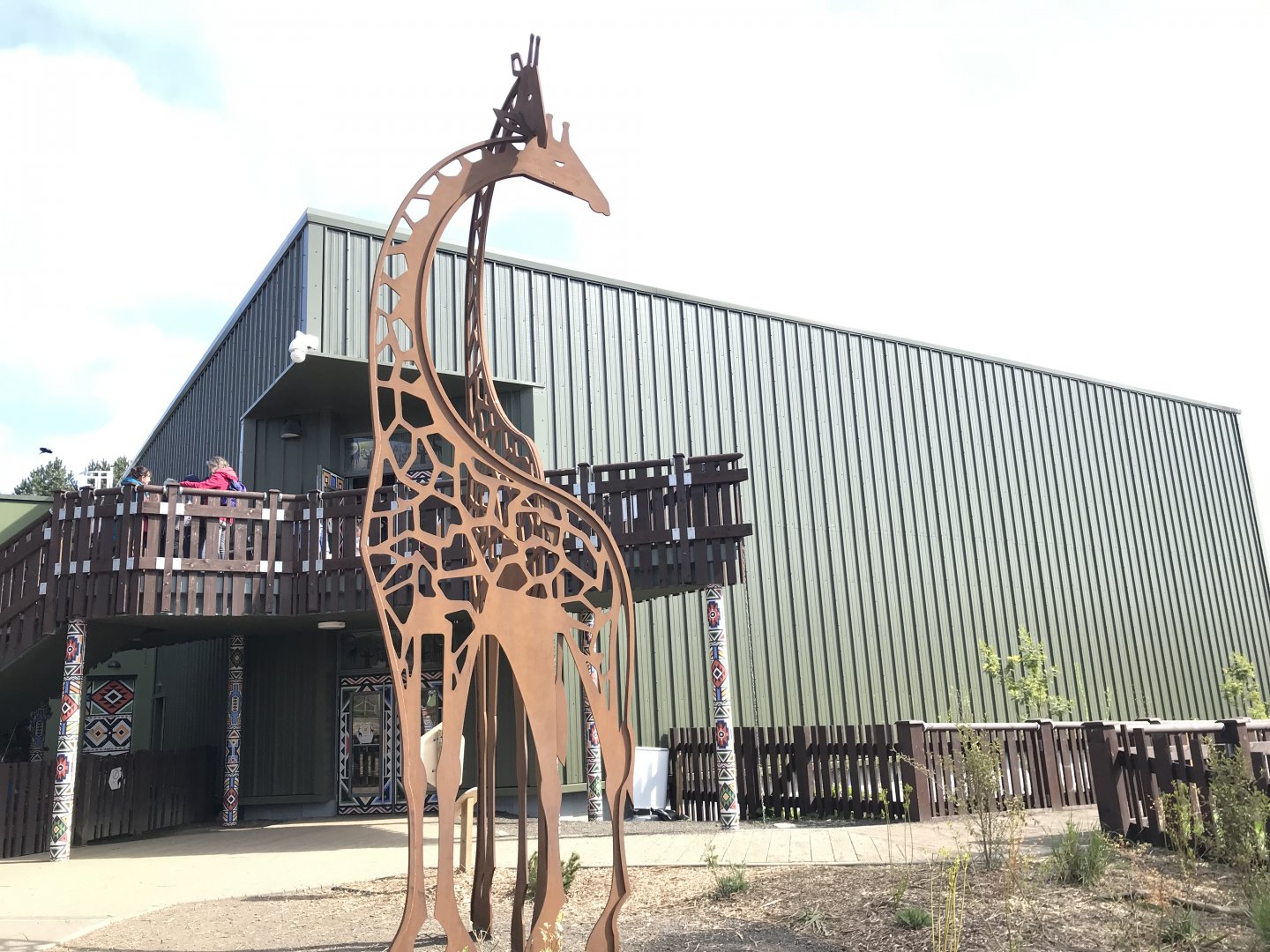Giraffe house and statue