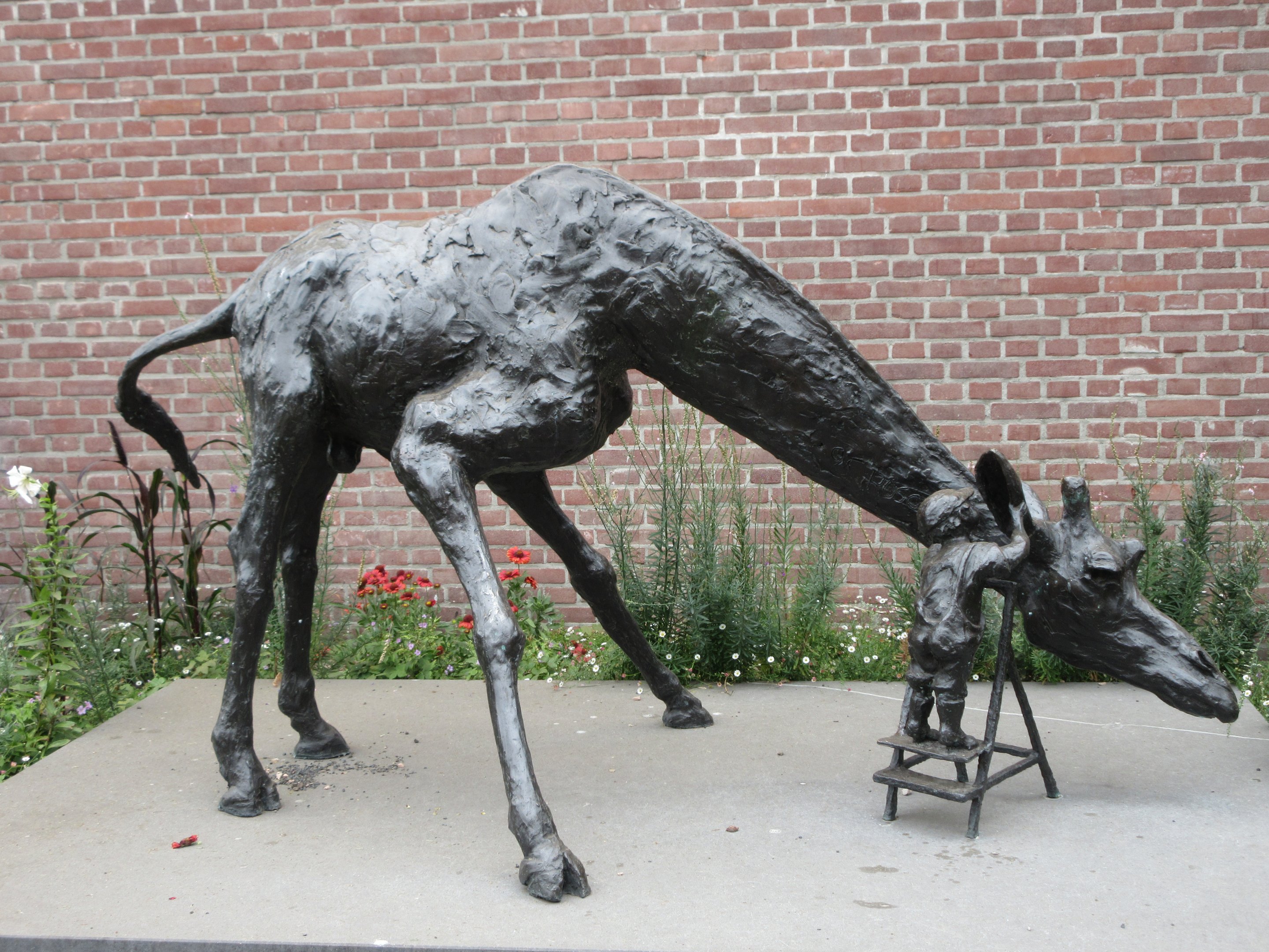 Giraffe Statue (perhaps 4 feet high and 7 feet in length)