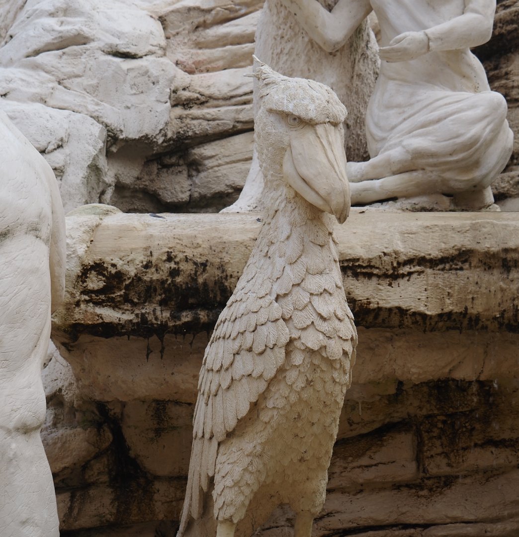 Golden Clock Square entrance area fountain with animal statues - Shoebill statue, 2024-09-17