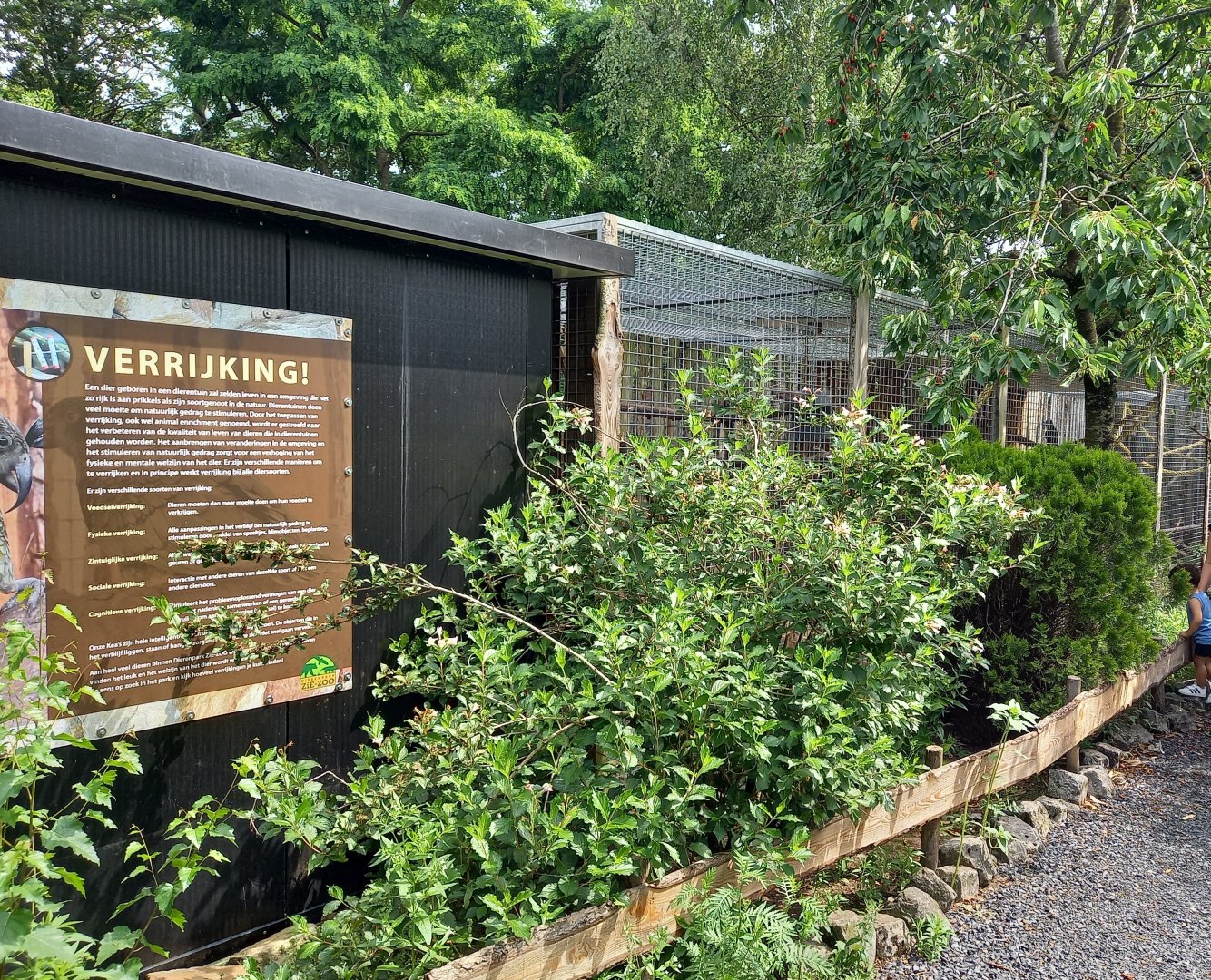 Kea-aviary with sign about enrichment