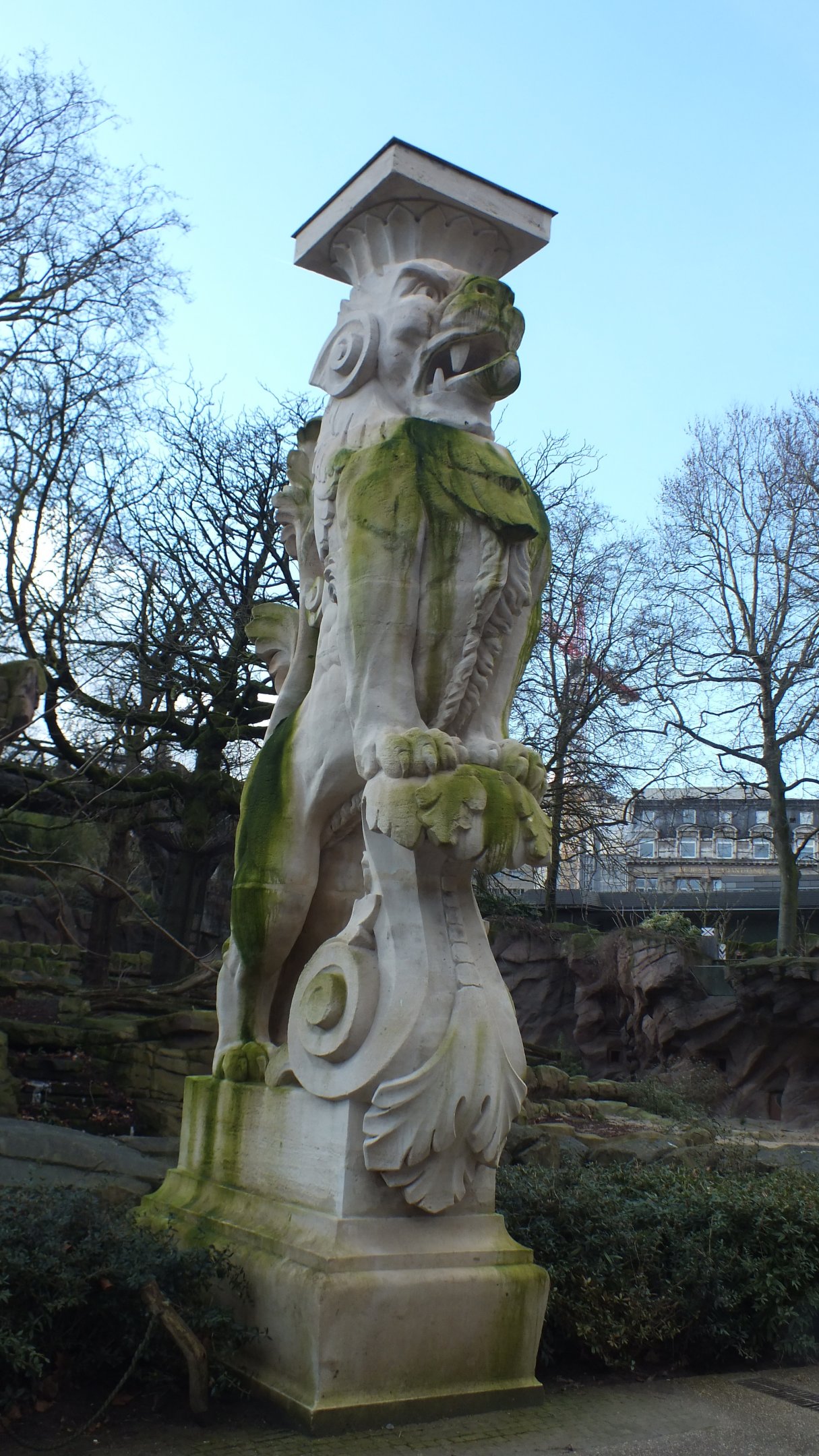 Lion Statue overlooking path.
