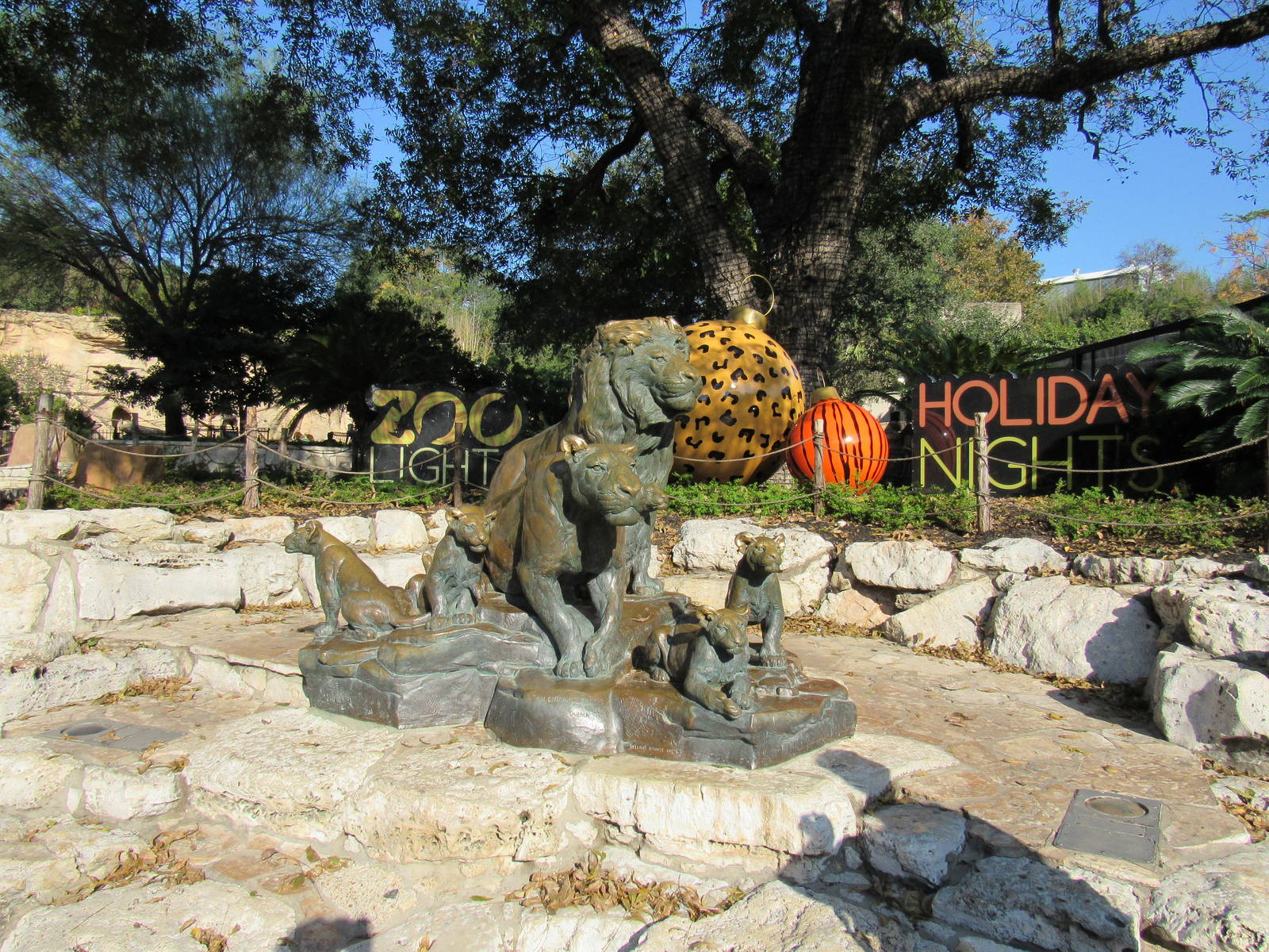 Lion Statures with Holiday Decorations in the background