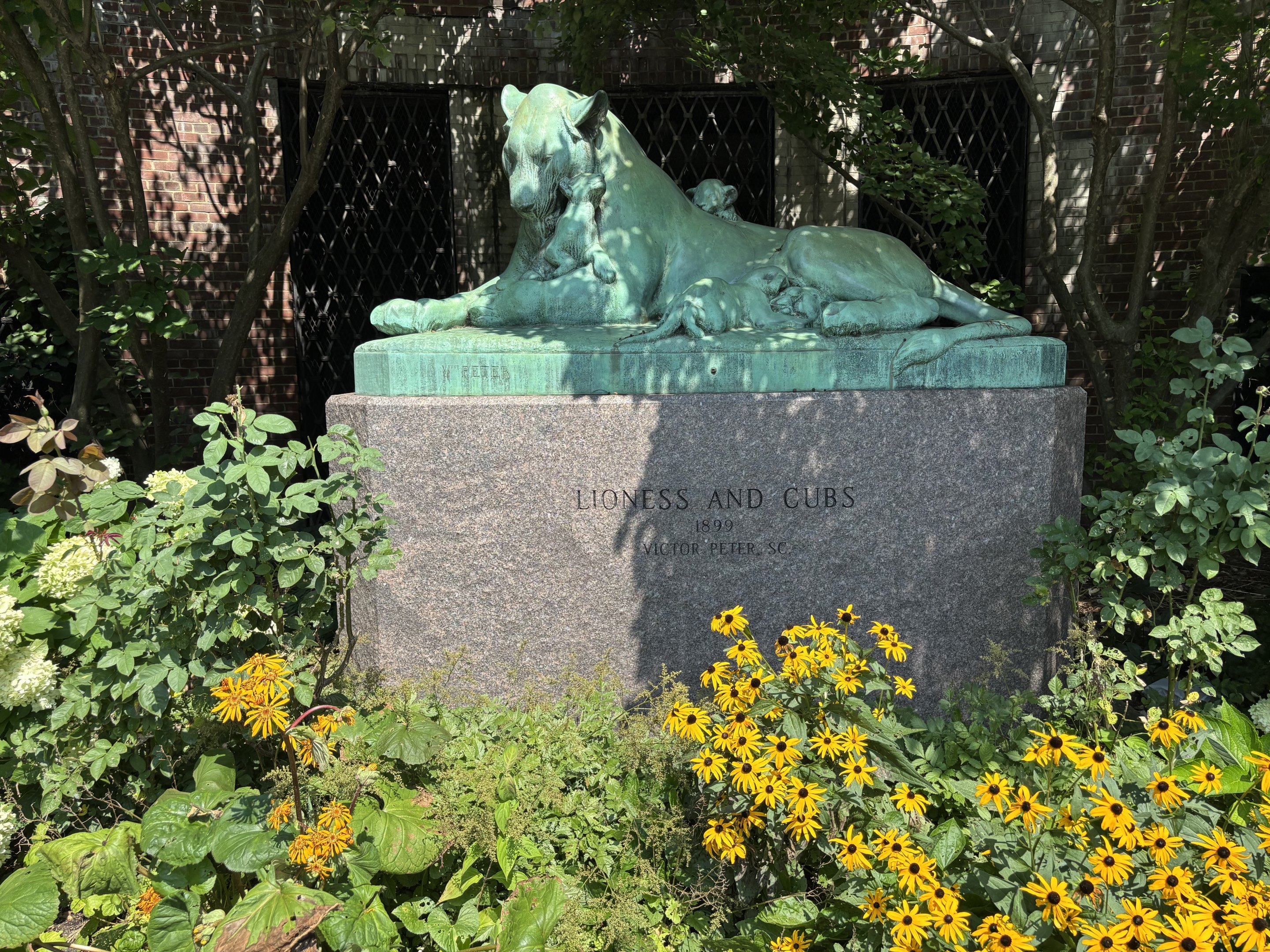 Lioness Statue + Flowers