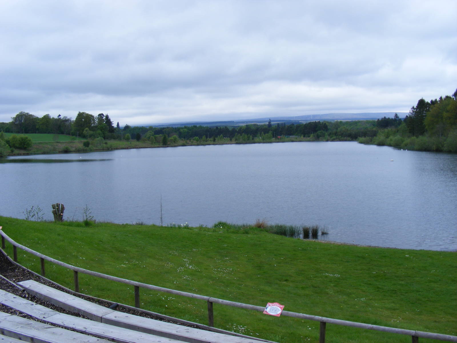 Loch in front of birds of prey display arena at Blair Drummond Safari Park,