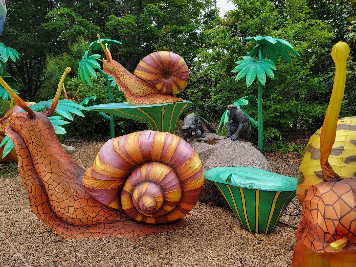 Louisville 5/22 - Primate statue, behind the snail lanterns