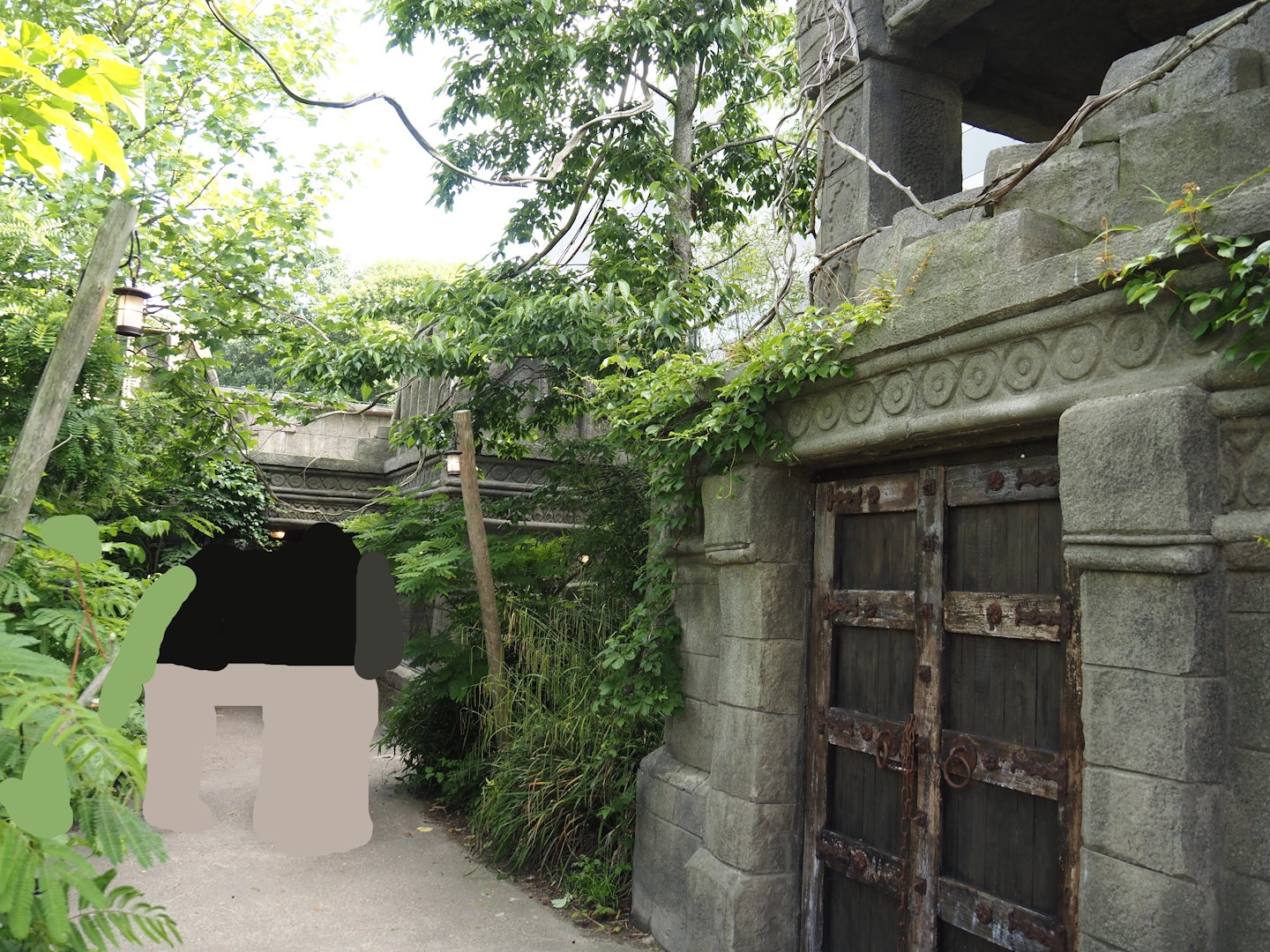 Monkey Ruins exhibit - Walkway and structures with indoor exhibits and elevated viewing area, 2024-06-23