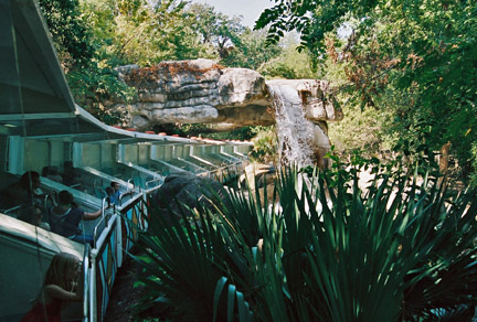 monorail exiting waterfall