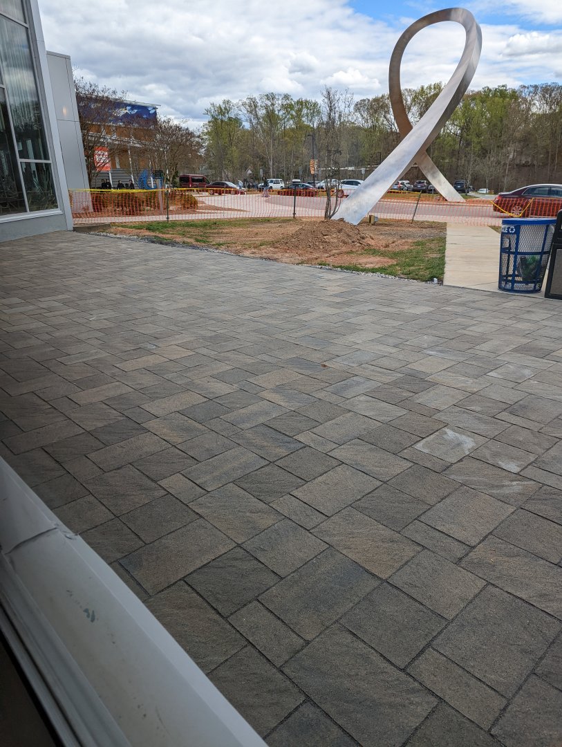 New tiles being installed in the entrance plaza