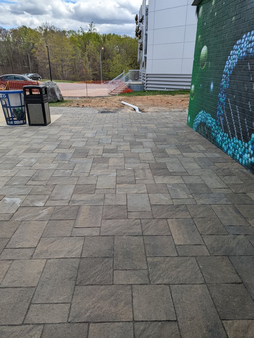 New tiles being installed in the entrance plaza