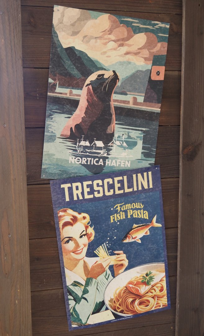 Nortica Hafên port themed area - Examples of fake advertisements in former sea lion theater, 2024-06-23
