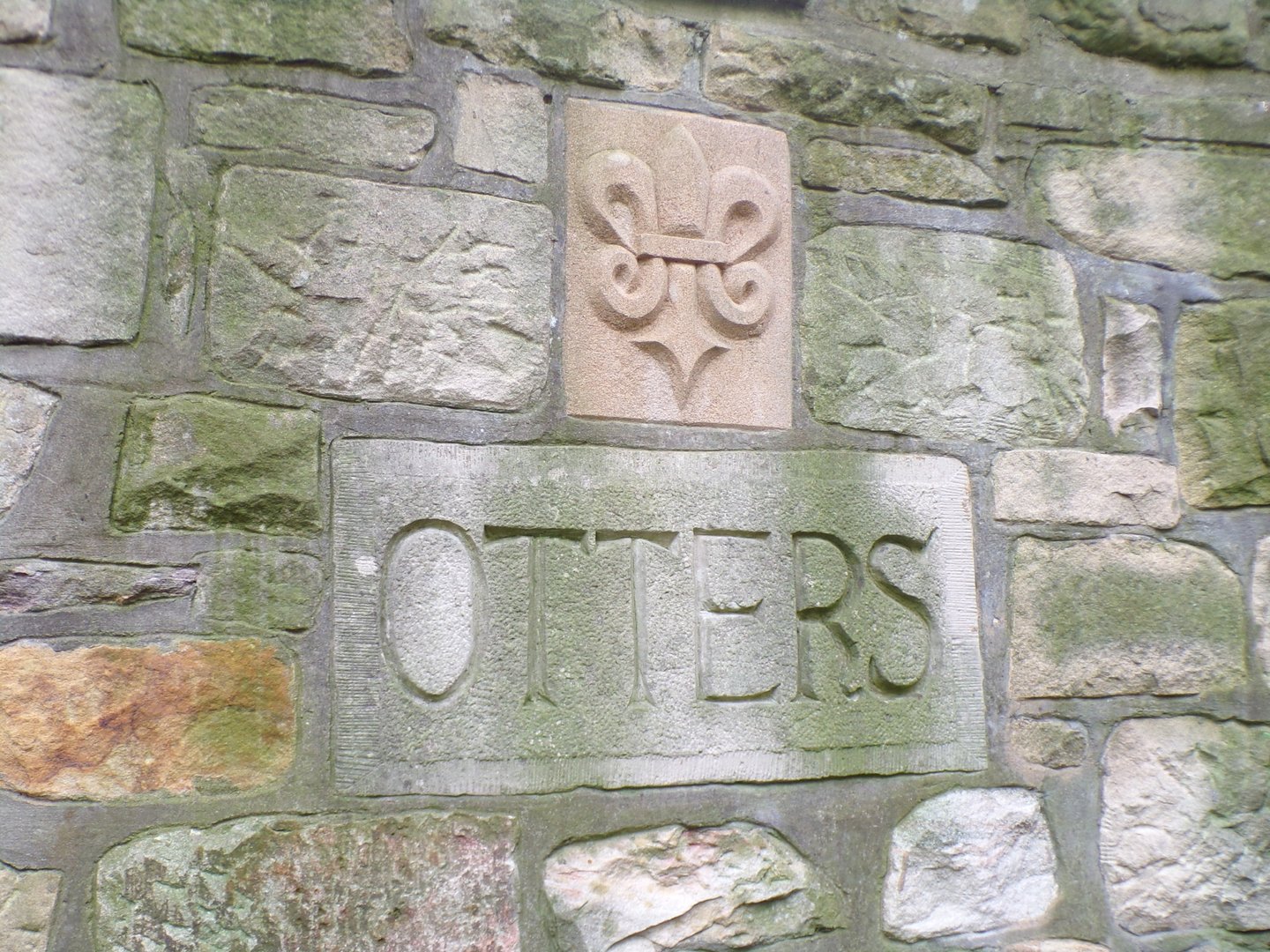 Old otter sign on red panda enclosure