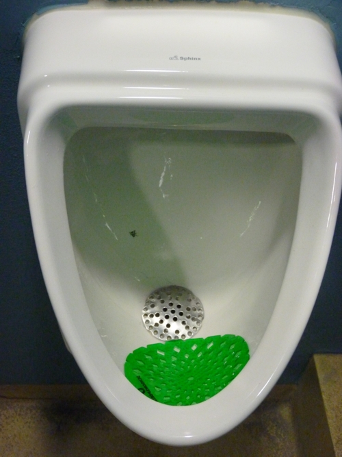 Original male urinary with a fly painted inside