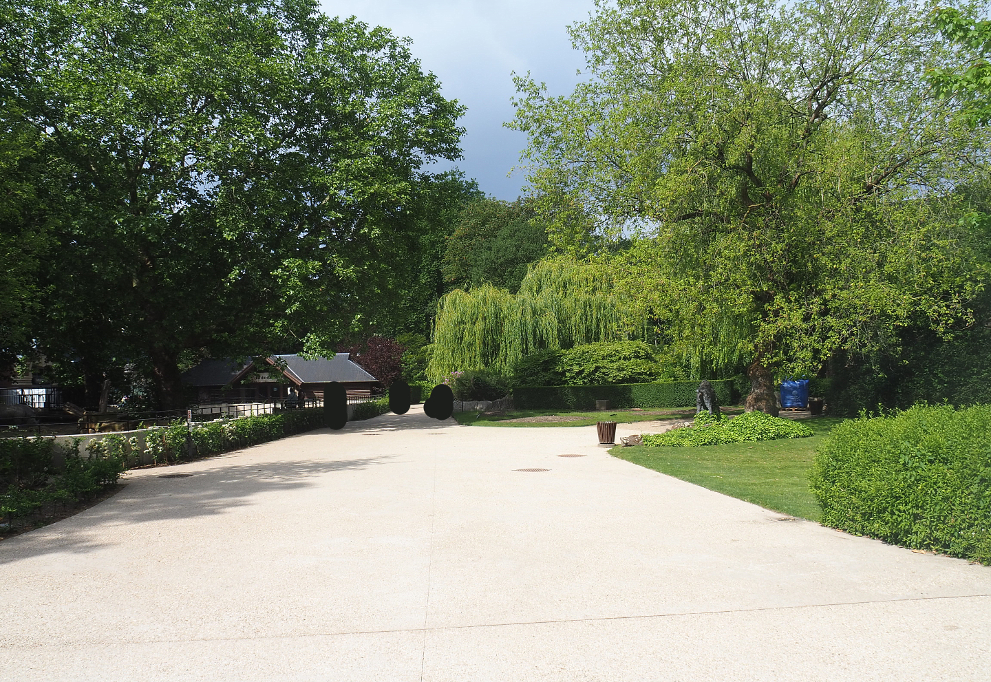 Park view of walkway alongside White rhinoceros paddock, 2022-05-26