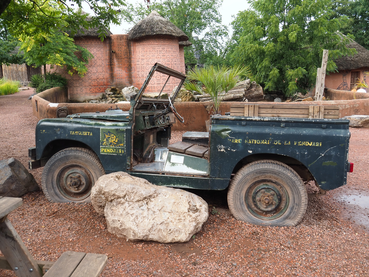 Pendjari National Park vehicle theming, with Red river hog paddock behind it, 2022-09-15