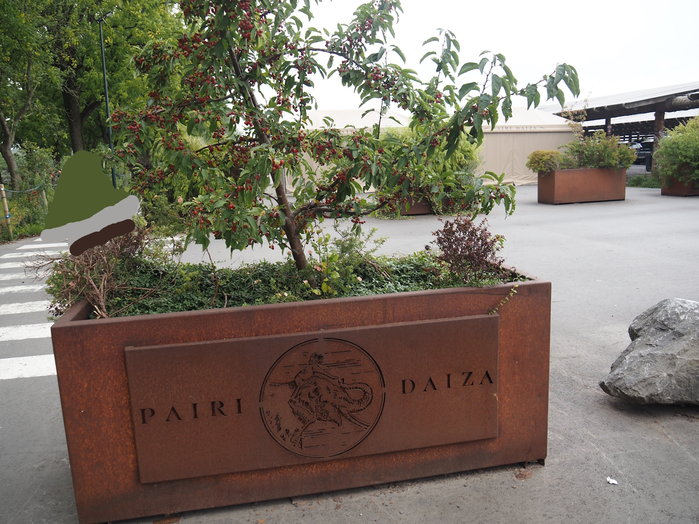 Planter with logo between the parking lot and the entrance, 2024-09-17