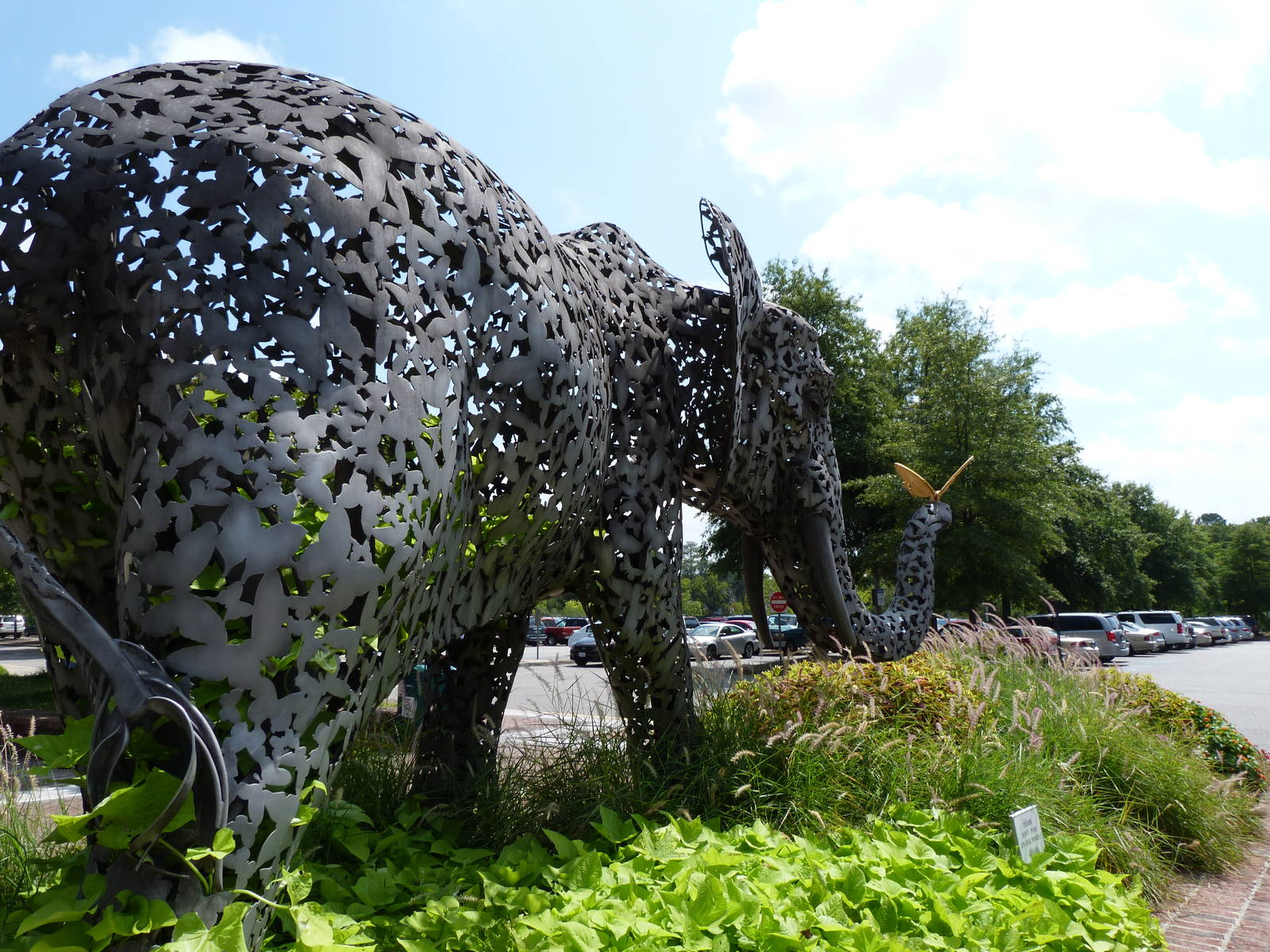 Plants Growing In Elephant Statue