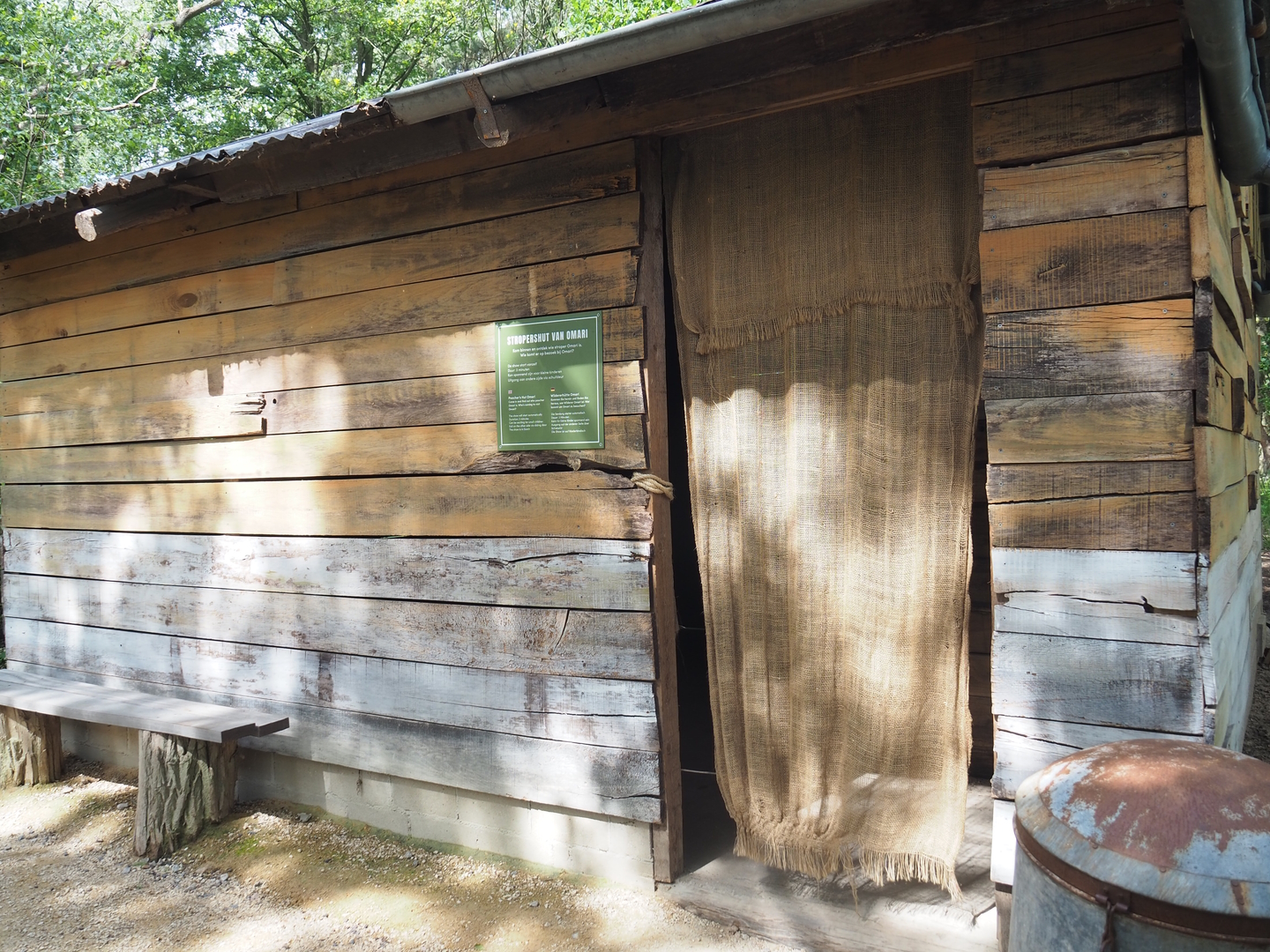Poachers' camp theming near black rhinoceros exhibit, 2022-06-12