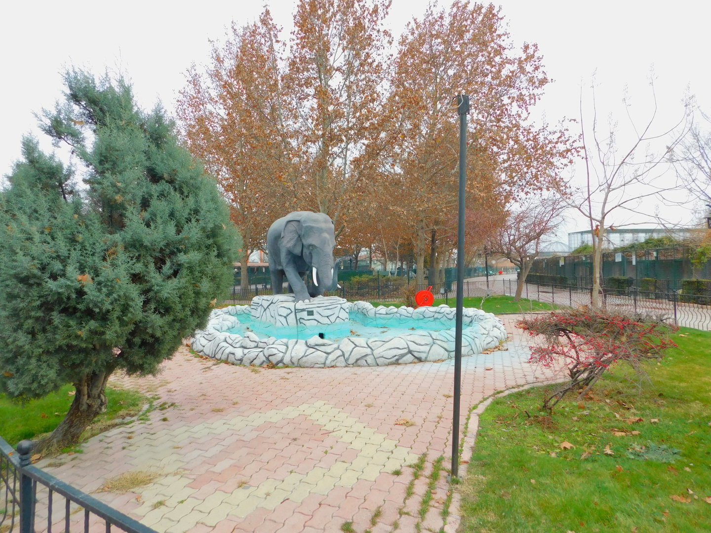 Pond with Elephant Statue at Karatay Zoo